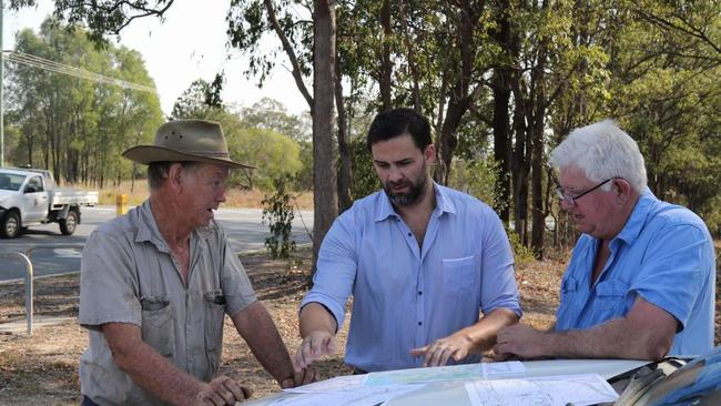 Gold Coast City Council Division One candidate Mark Hammel (standing in the middle) with locals Geoff Rossman and Dave Collard discussing the maps for the Coomera Connector.