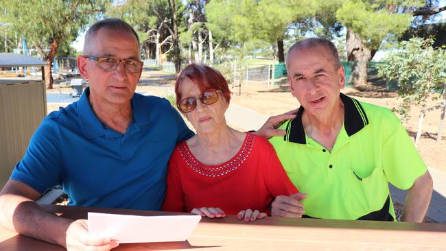 NDIS recipient Neil D'Cruz, right, who faces losing his Salisbury East home, with his mother Jean – who is going into aged care – and brother Andrew.