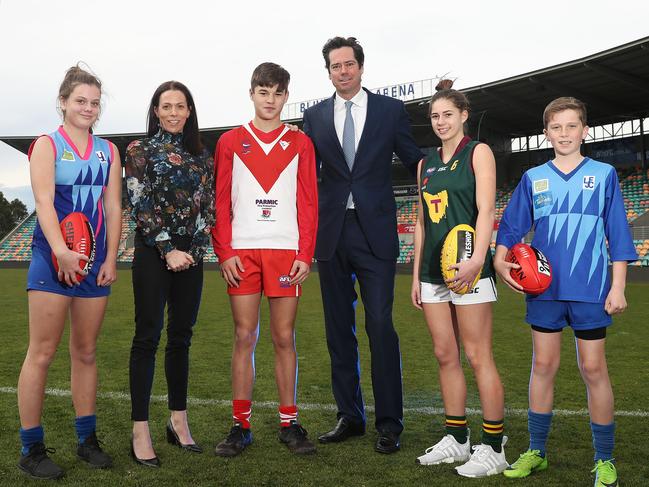 Trisha Squires and Gillon McLachlan with Clarence and Lindisfarne junior players. Picture: LUKE BOWDEN