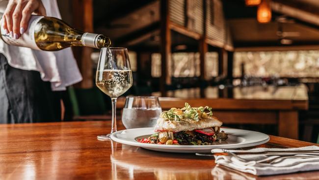 Dining at the main lodge at Bamurru Plains. Picture: Hels Orr