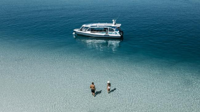 K'gari. Couple on tour from Kingfisher Bay Resort - West Coast Cruise. Escape 12 November 202372hrs - K'GariPhoto - supplied by Kingfisher Bay Resort