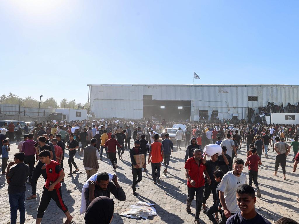 The scene outside the World Food Programme warehouse in Deir el-Balah. Picture: AFP)