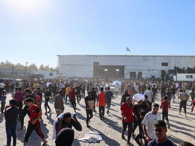 The scene outside the World Food Programme warehouse in Deir el-Balah. Picture: AFP)