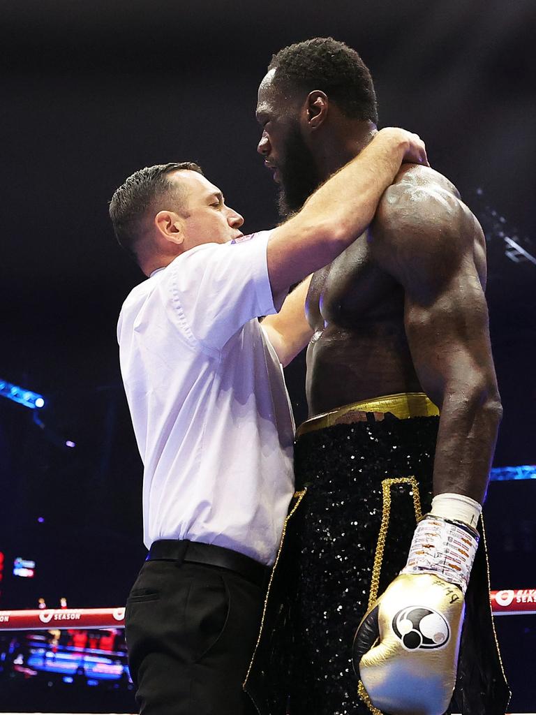 Referee Kieran McCann stops the bout. Photo by Richard Pelham/Getty Images)