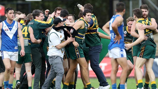 Pembroke players celebrate after their Division 3 win over Athelstone. It was a very different story when the promoted teams met in Round 1 in Division 2. Picture: Calum Robertson