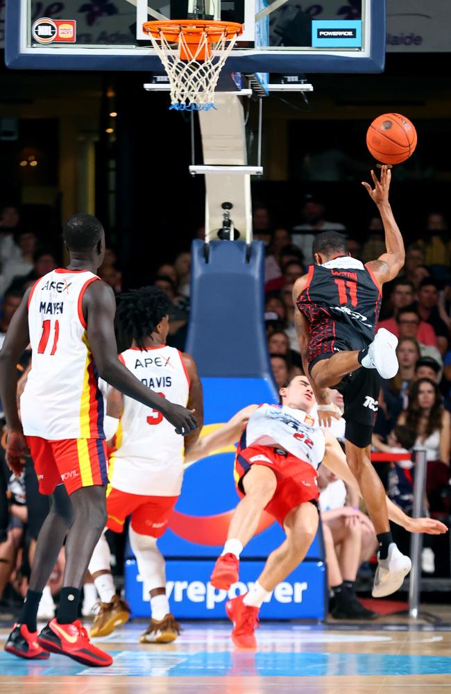 Bryce Cotton collects Adelaide swingman Nick Marshall. Picture: Kelly Barnes/Getty Images