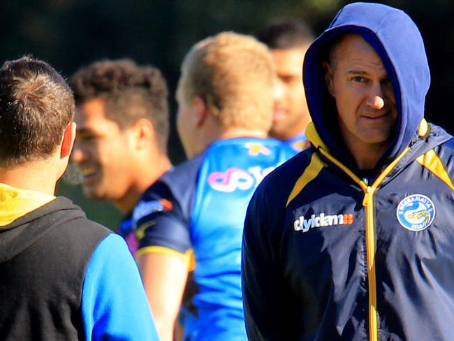 Brad Arthur watches as Eels players warm up at the Clubs North Parramatta training ground. pic Mark Evans