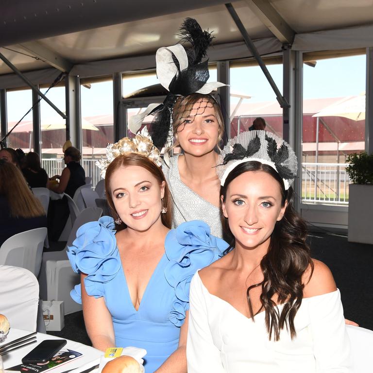 Rachel Howells, Georgie Took and Sarah Roberts at the Darwin Turf Club Bridge Toyota Ladies' Day / Derby Day. Picture: KATRINA BRIDGEFORD