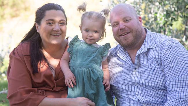 Darryl Megaw, 37, who was diagnosed with a brain tumour, with his wife Rhylee Megaw and their one-and-a-half-year-old daughter Ellie. Picture: Supplied