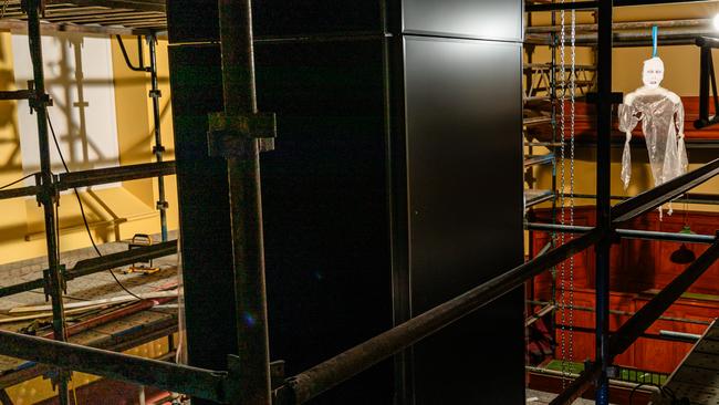 A four-way screen being installed at the new Convict Memorial Hub in the Penitentiary Chapel, Hobart. Picture: Linda Higginson