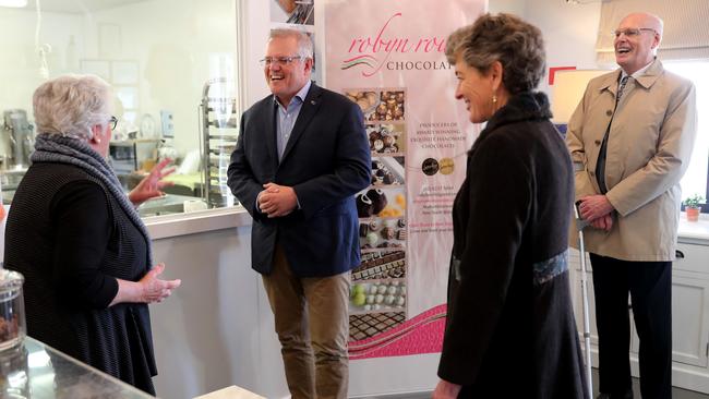 Scott Morrison and Liberal candidate Fiona Kotvojs sweet talk with locals ahead of the Eden-Monaro by-election. Picture: Adam Taylor/PMO