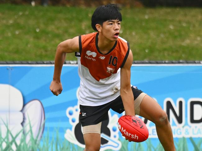 Hau-Tze Rock of the Northern Territory handballs during the AFL 2024 Under 16 Boys Championships match between Northern Territory and Tasmania at Trevor Barker Beach Oval on June 8, 2024 in Melbourne, Australia. Picture: Morgan Hancock/AFL Photos