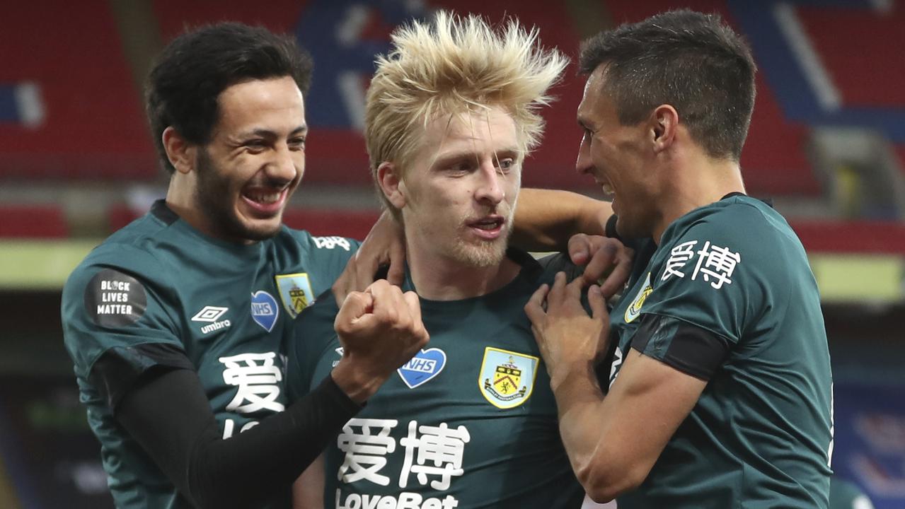 Burnley's Ben Mee, centre, is congratulated by teammates after scoring the winner.