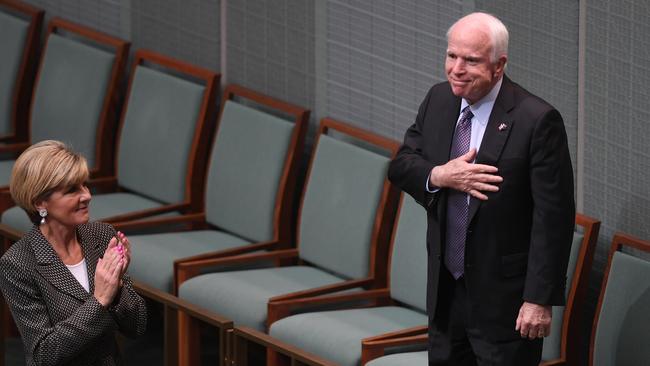 John McCain acknowledges the applause of MPs, including then foreign minister Julie Bishop during his visit to the House of Representatives Question Time in May last year. Picture: AAP