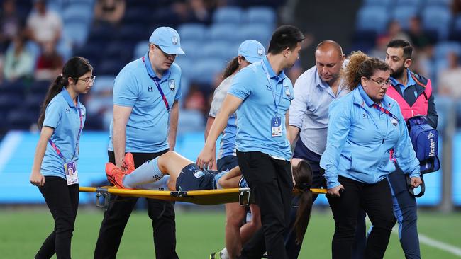 Natalie Tobin is stretchered from the field during the round one of the 2023 season. Picture: Mark Metcalfe/Getty Images