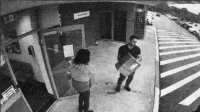 Halil Delialioglu (dark shirt) picking up boxes of GBL from a Toll shipping depot in Eastern Creek. Picture: NSW Police