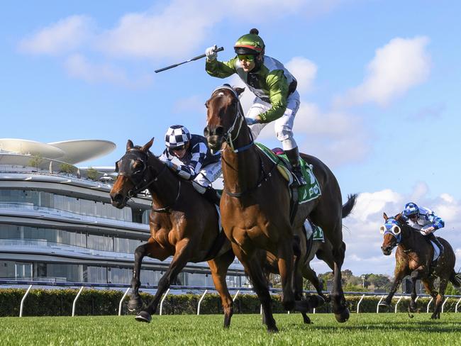 MELBOURNE, AUSTRALIA - OCTOBER 02: Brett Prebble riding Incentivise winning Race 7, the Tab Turnbull Stakes, during Melbourne Racing at Flemington Racecourse on October 02, 2021 in Melbourne, Australia. (Photo by Vince Caligiuri/Getty Images)