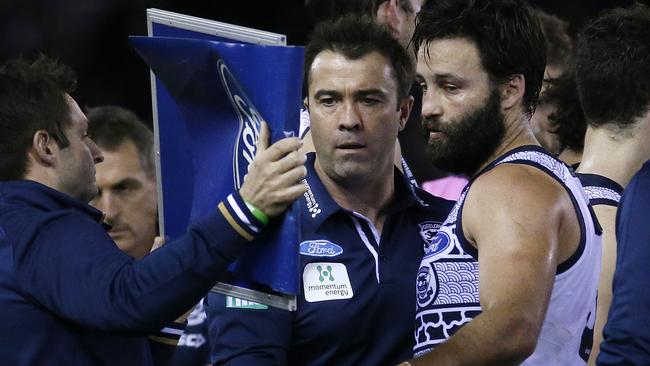 Is that a whiteboard or a mirror? Chris Scott and Jimmy Bartel during the three-quarter time break against Carlton. Picture: Colleen Petch