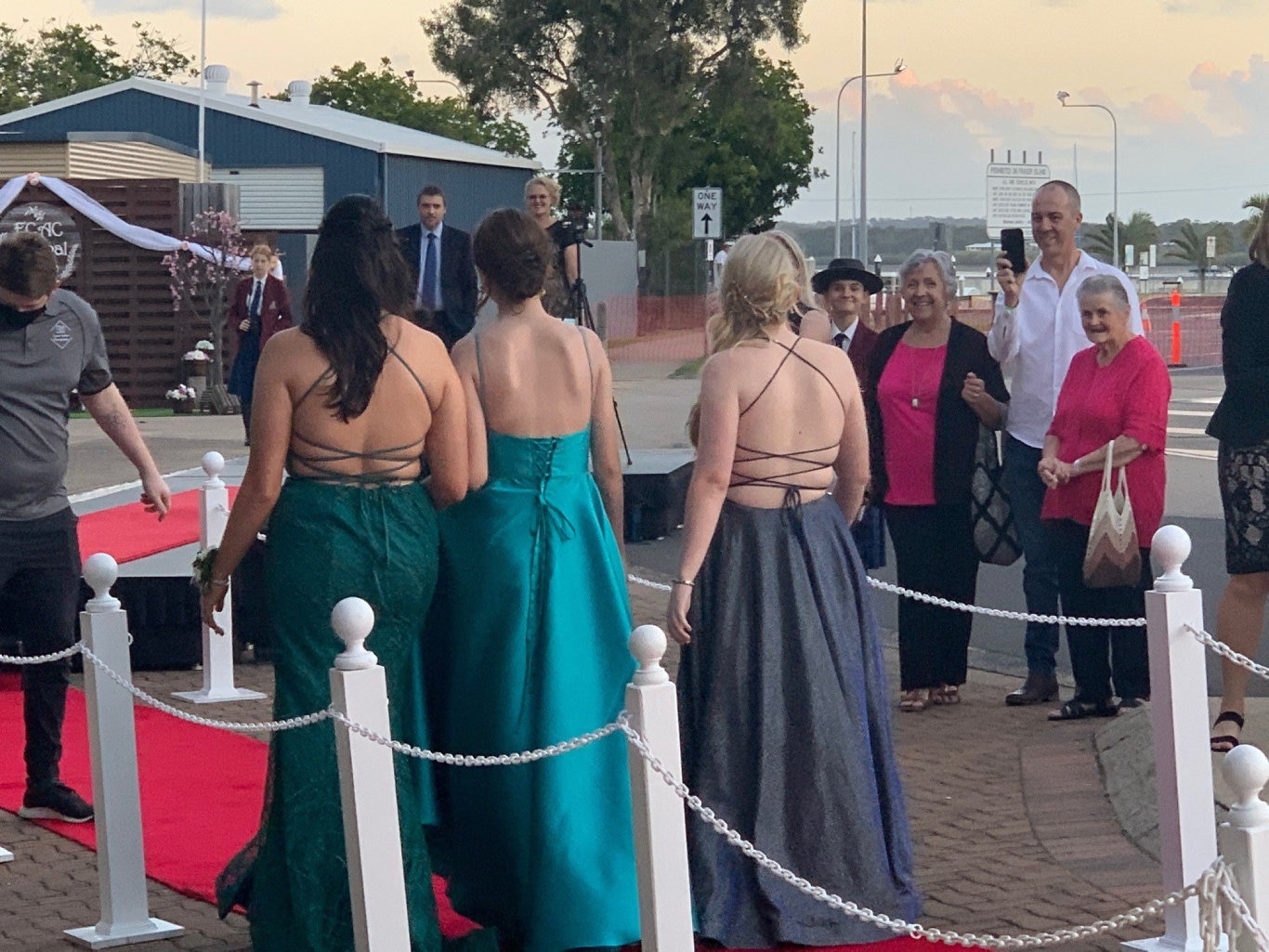 Grace Buckley, Georgia McTaggart and Maya Mackay walking into the Fraser Coast Anglican College formal.