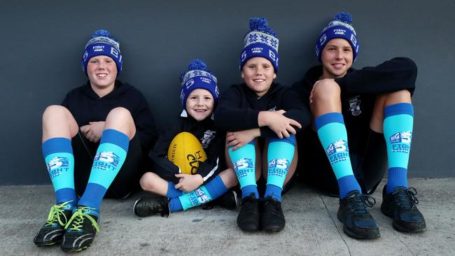 Northern Lakes Power AFL players Noah Taggart, Jack Willding, Zahli Taggart and Max Barsby for “Sock it to NMD". (AAP Image/Sue Graham)