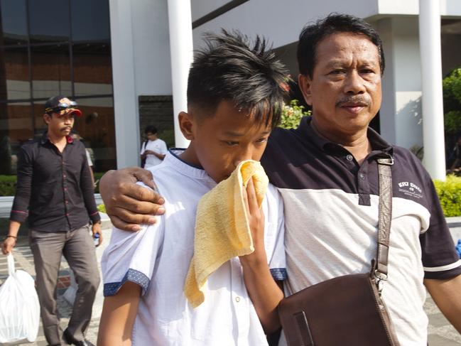 A man comforts a boy whose relative was on the flight. Picture: Ed Wray/Getty Images