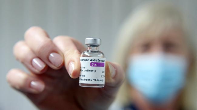 A vial of the AstraZeneca/Oxford Covid-19 vaccine is held at the Pontcae Medical Practice in Merthyr Tydfil in south Wales.