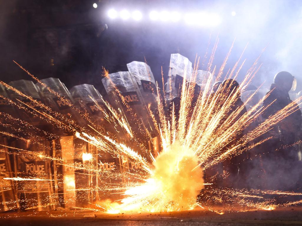 Protesters shot fireworks at riot police on the streets of Tbilisi after the government delayed talks to join the European Union.Picture: Giorgi ARJEVANIDZE / AFP