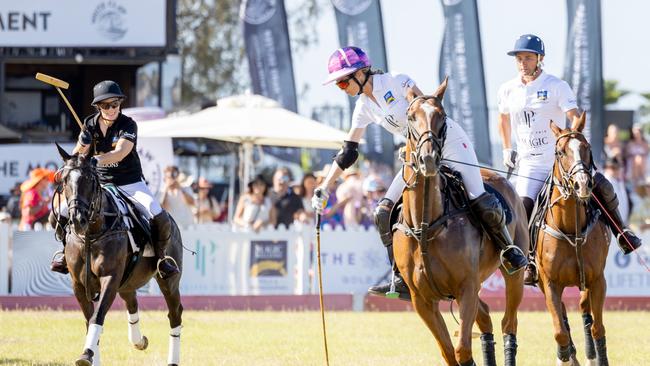 Zara Tindall and Delfina Blaquier in action during the Magic Millions Polo. Picture by Luke Marsden