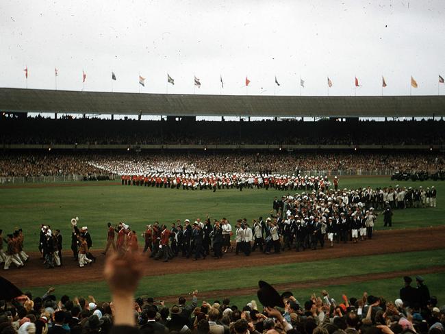 Athletes marching together, not in their teams, at the 1956 Olympic Games closing ceremony at the MCG. Picture: Albert Fowler