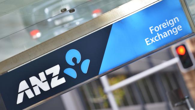 A sign for the Australia and New Zealand (ANZ) Banking Group is seen outside a branch in Sydney on May 5, 2015. ANZ posted a modest first half net profit rise of three percent to Aus$3.5 billion (US$2.7 billion), spurred by growth in both domestic and international operations. AFP PHOTO / Peter PARKS