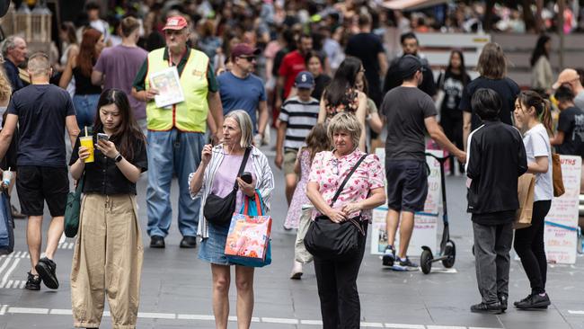 MELBOURNE, AUSTRALIA - NewsWire Photos - 14 DECEMBER, 2024: People carry shopping bags along Bourke Street Mall.  Picture: NewsWire / Diego Fedele