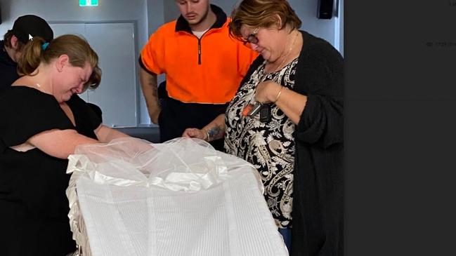 Harrowing: The family checks Aaron's corpse before the funeral.