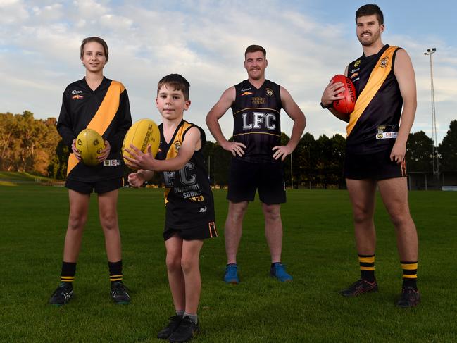 5/5/2020 - Support Our Clubs campaign - Sports clubs around the state are doing it tough but the Lobethal Football Club is one of the few hit by both the bushfires and coronavirus. Pictured are Torsten Skinner (under 14 player), Jensen Blundell (under 8 player), Matthew Fuller (coach), Cooper Skinner (senior player) at the club. Photo - Naomi Jellicoe