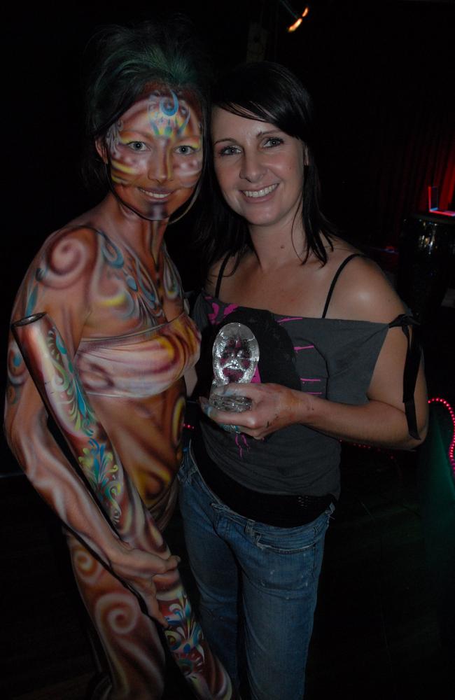 Model Shannon Truscott with winning artist Katrina Farrar, for the airbrushing category, at the 2007 Body Art Carnivale.