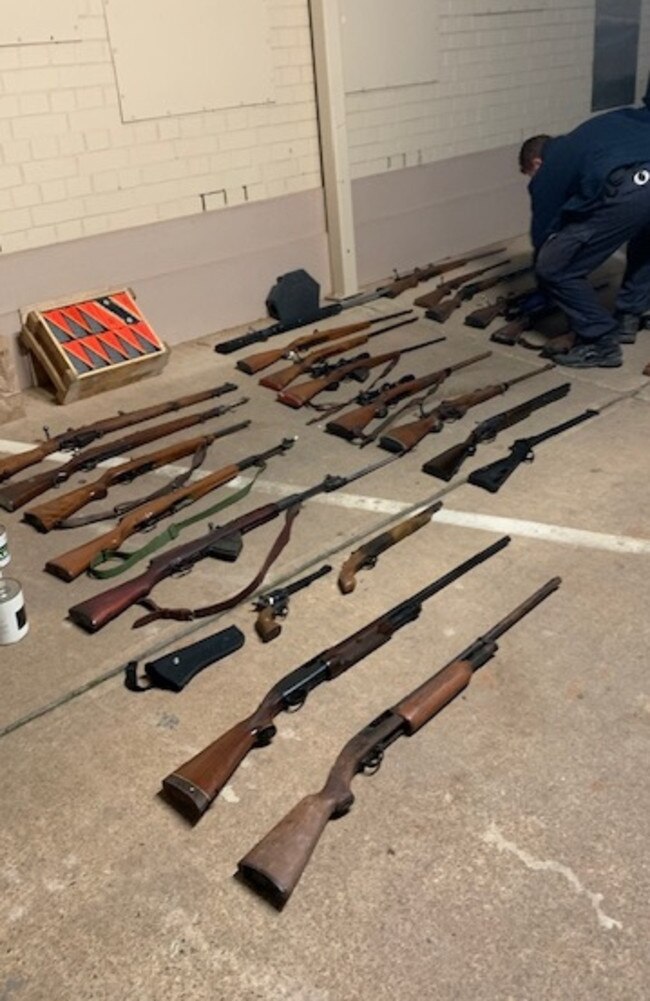 31 unregistered weapons were seized from the Adelong home following a tip-off.