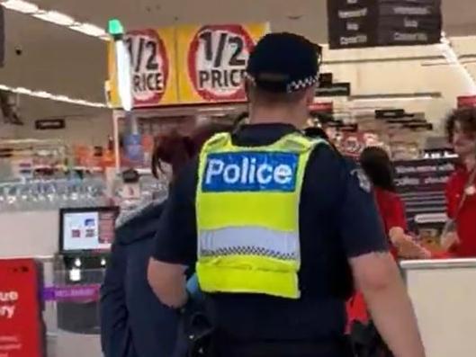 Police officers arrest a women in Bay Street, Port Melbourne  for stealing on Tuesday. Source: Supplied,