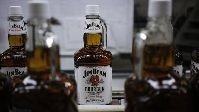 Bottles of Jim Beam Bourbon make their way down a conveyor belt inside the bottling plant at the Jim Beam Bourbon Distillery in Clermont, Kentucky. Picture: AFP