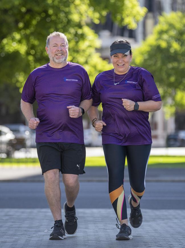 Greg Ireland and Magda Pearce warming up at Victoria Square in the city in readiness for running in the New York marathon, in honour of their children. Picture Mark Brake