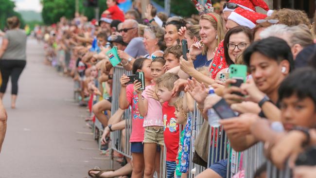 Crowds line the route for the annual Christmas Pageant and Parade down the Esplanade and Knuckey Streets. Picture: Glenn Campbell