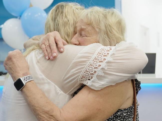 Barbara Marriott, who has recently spent three months in hospital, had tears in her eyes at the opening of the new Tin Can Bay medical centre. She is pictured hugging practice manager Mary Van Beek.