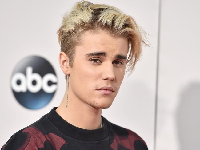 FILE - In this Sunday, Nov. 22, 2015 file photo, Justin Bieber arrives at the American Music Awards at the Microsoft Theater in Los Angeles. A singer songwriter has sued Bieber and Skrillex for copyright infringement over their multi-platinum song, “Sorry.” Casey Dienel, who performs under the name White Hinterland, filed suit against the two performers as well as their publishing companies, Universal Music and co-writers in federal court in Nashville, Tennessee, on Wednesday, May 25, 2016, which claims that “Sorry” uses a vocal riff from her song “Ring the Bell.” (Photo by Jordan Strauss/Invision/AP, File)