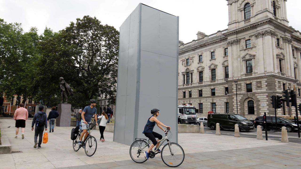 A statue of British wartime leader Winston Churchill has been boarded up on parliament Square in central London. Picture: Tolga Akmen/AFP