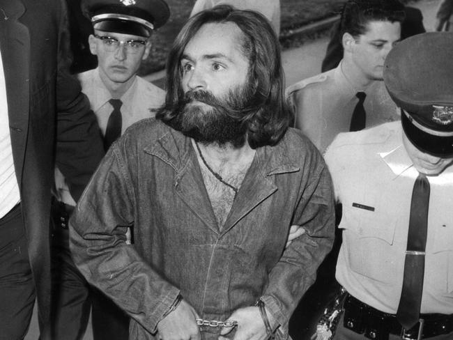 1969: Charles Manson is escorted to court for a preliminary hearing on December 3, in Los Angeles, California. Picture: John Malmin