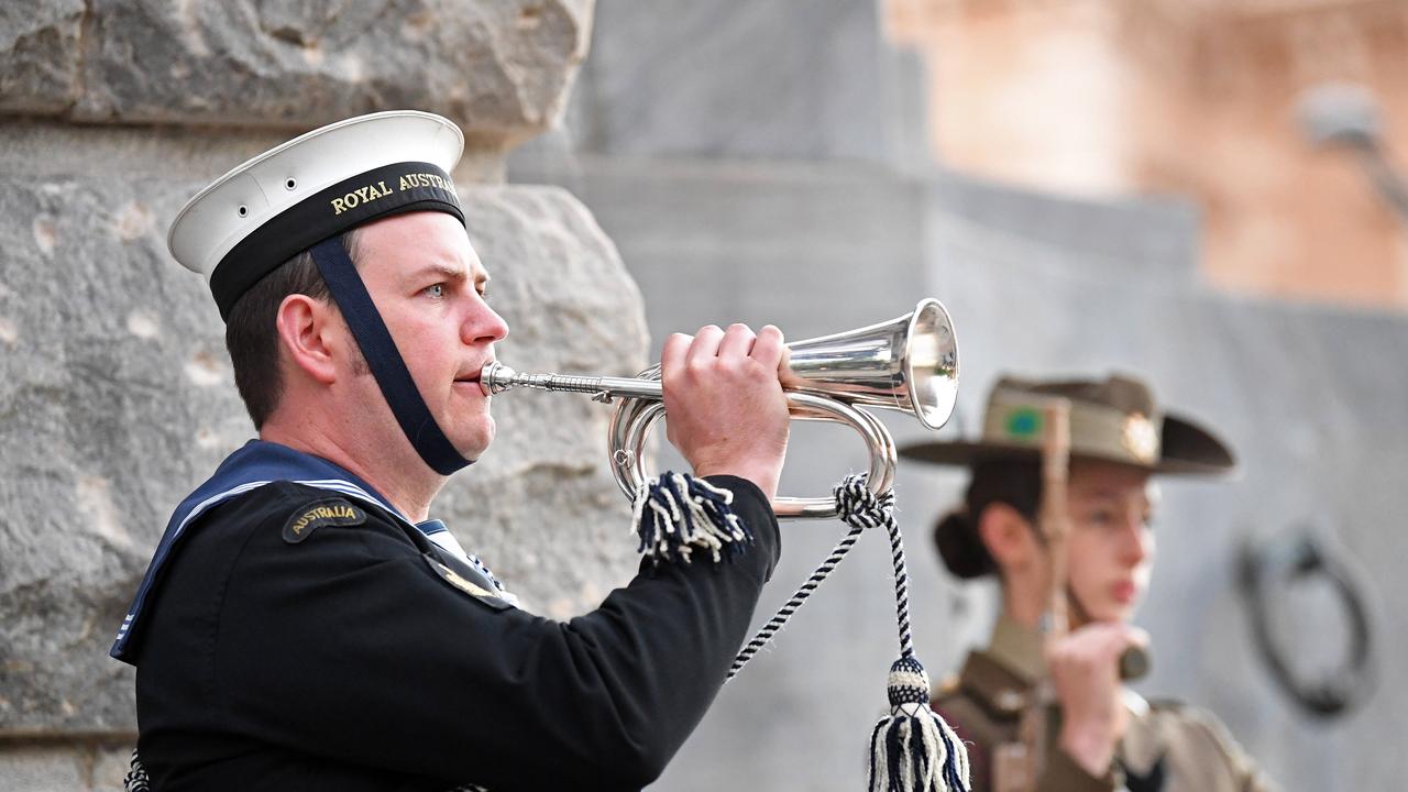 The last post during Anzac Day Dawn Service at the South Australian National War Memorial on North Terrace, Adelaide. Picture: Tom Huntley