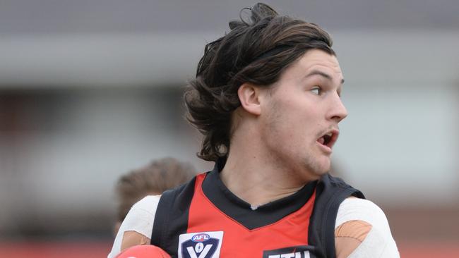 VFL football Frankston v Collingwood at Frankston. Frankston defender Nick Newman wins the ball.