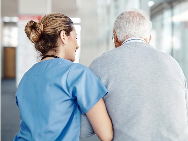 AGED CARE/NURSING HOME/SENIOR/RESIDENTIAL CARE. Picture: istock   Shot of a female nurse assisting her senior patient while walking