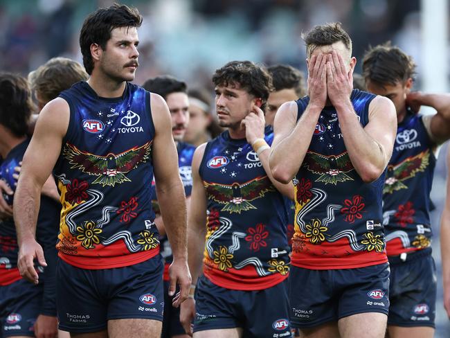 Darcy Fogarty and Brodie Smith after Adelaide’s loss on Saturday. Picture: Quinn Rooney/Getty Images