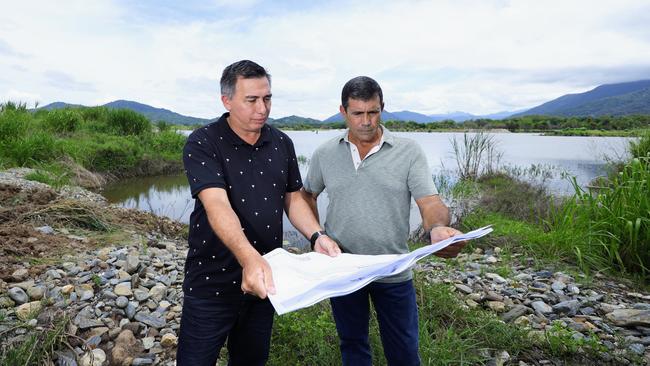 Two Cairns watersports enthusiasts are in the consultancy stage with Cairns Regional Council about constructing an international standard watersports park at Caravonica. Darryl Johnson and Michael Sciacca look over plans to build five lakes to international competition standard on the current site of the Pioneer sand quarry, off the Western Arterial Road at Caravonica. Picture: Brendan Radke