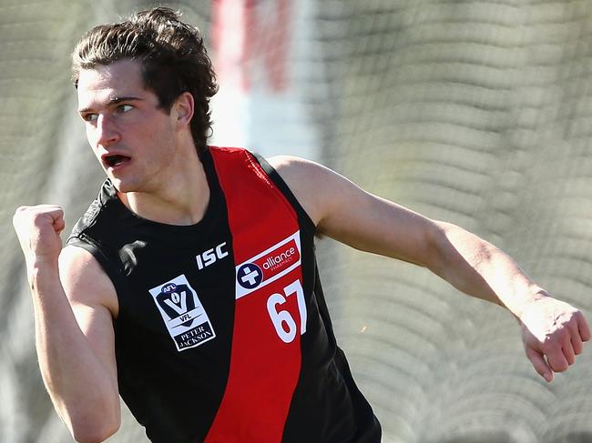 MELBOURNE, AUSTRALIA - AUGUST 18:  Jacob Brown of Essendon celebrates a goal during the round 20 VFL match between Essendon and Footscray at Windy Hill on August 18, 2018 in Melbourne, Australia.  (Photo by Robert Prezioso/AFL Media/Getty Images)