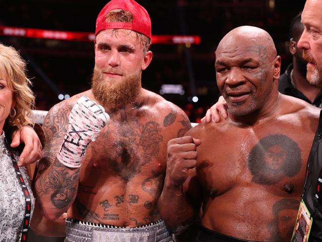 ARLINGTON, TEXAS - NOVEMBER 15: (L-R) Jake Paul announced as winner against Mike Tyson during LIVE On Netflix: Jake Paul vs. Mike Tyson at AT&T Stadium on November 15, 2024 in Arlington, Texas. (Photo by Al Bello/Getty Images for Netflix Ã‚Â© 2024)